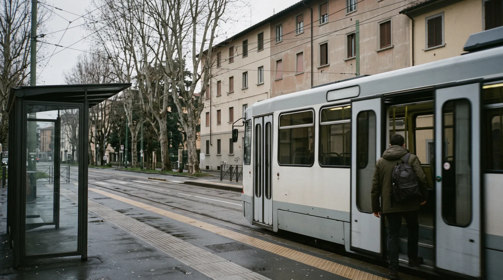 A T2 tram at a city-centre stop in the early morning, getting around Florence by tram and on foot