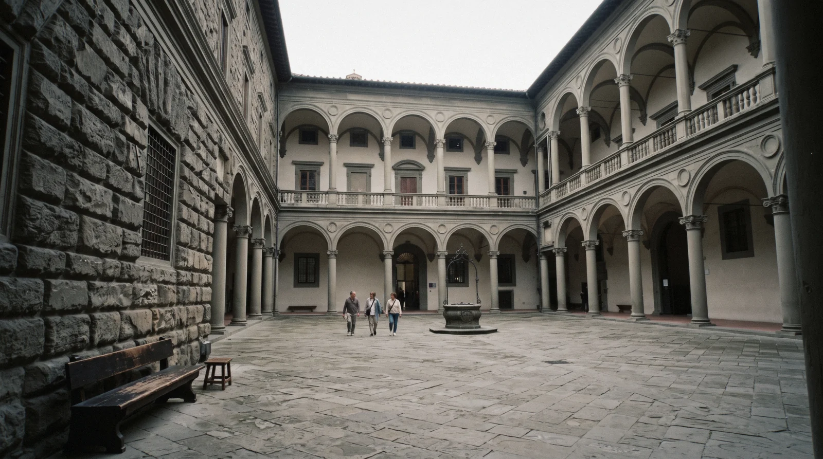 The rusticated stone facade of Palazzo Strozzi in Florence with its wrought-iron lanterns, home of the Broken exhibition