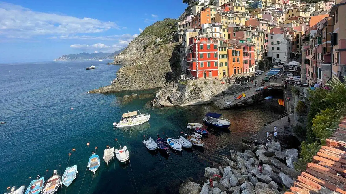 Boat cruise past Manarola on a Cinque Terre day trip with street food option from Florence, Italy