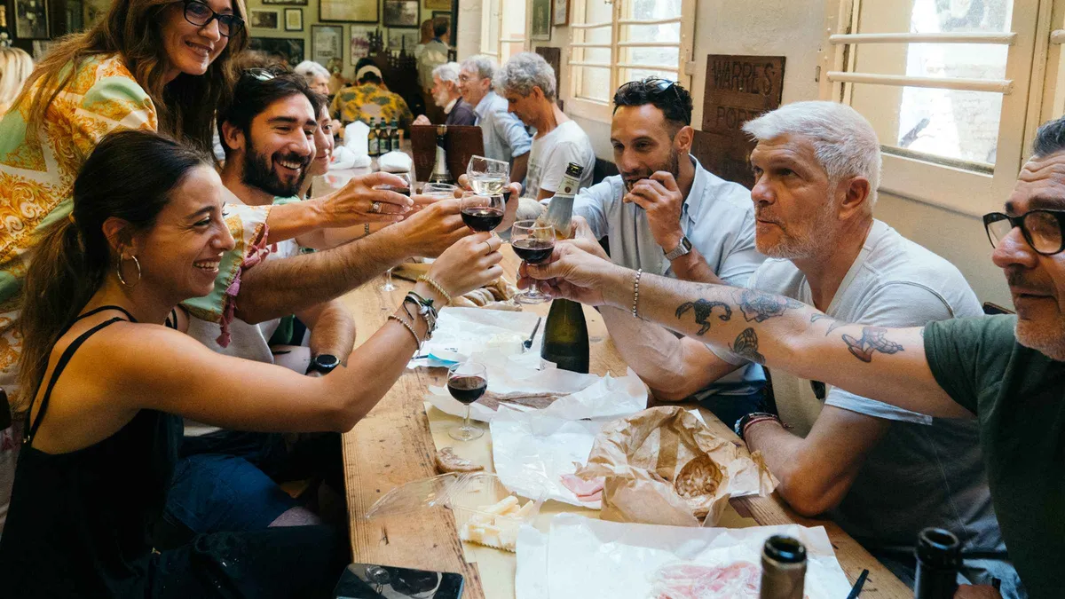 Mortadella and Parmigiano tasting on a Bologna walking food tour, a day trip from Florence by train