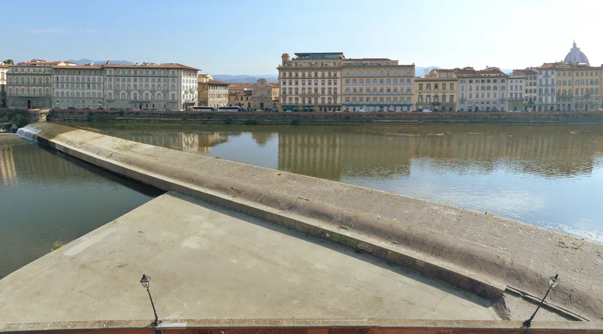 The Pescaia di Santa Rosa weir across the Arno seen from the Oltrarno bank, the downstream limit of a Florence boat tour