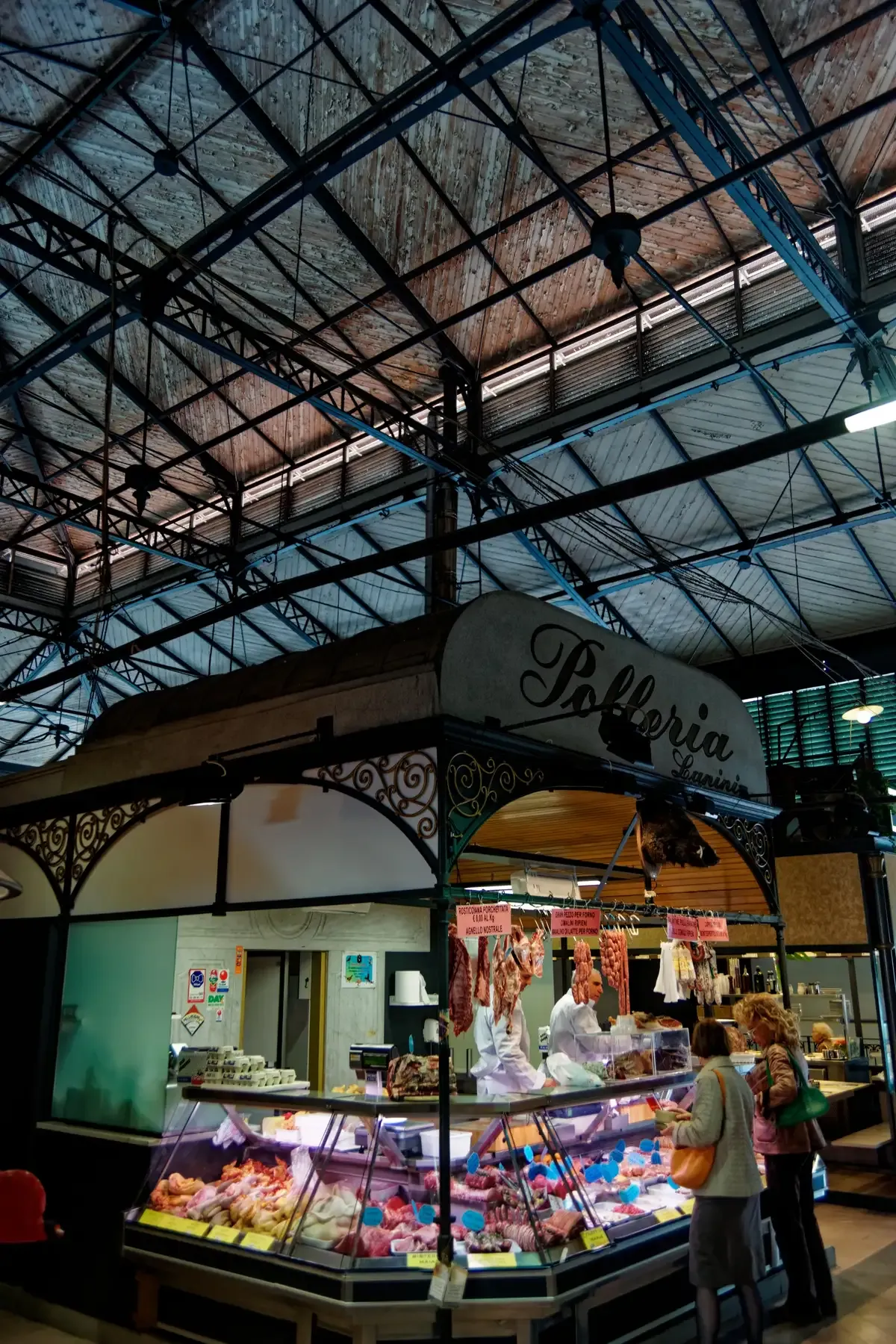 A poultry counter under the iron and glass roof of the Sant'Ambrogio market in the Santa Croce neighbourhood of Florence