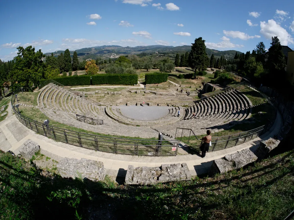 The Roman theatre in the Fiesole archaeological area, with the hills above Florence behind it