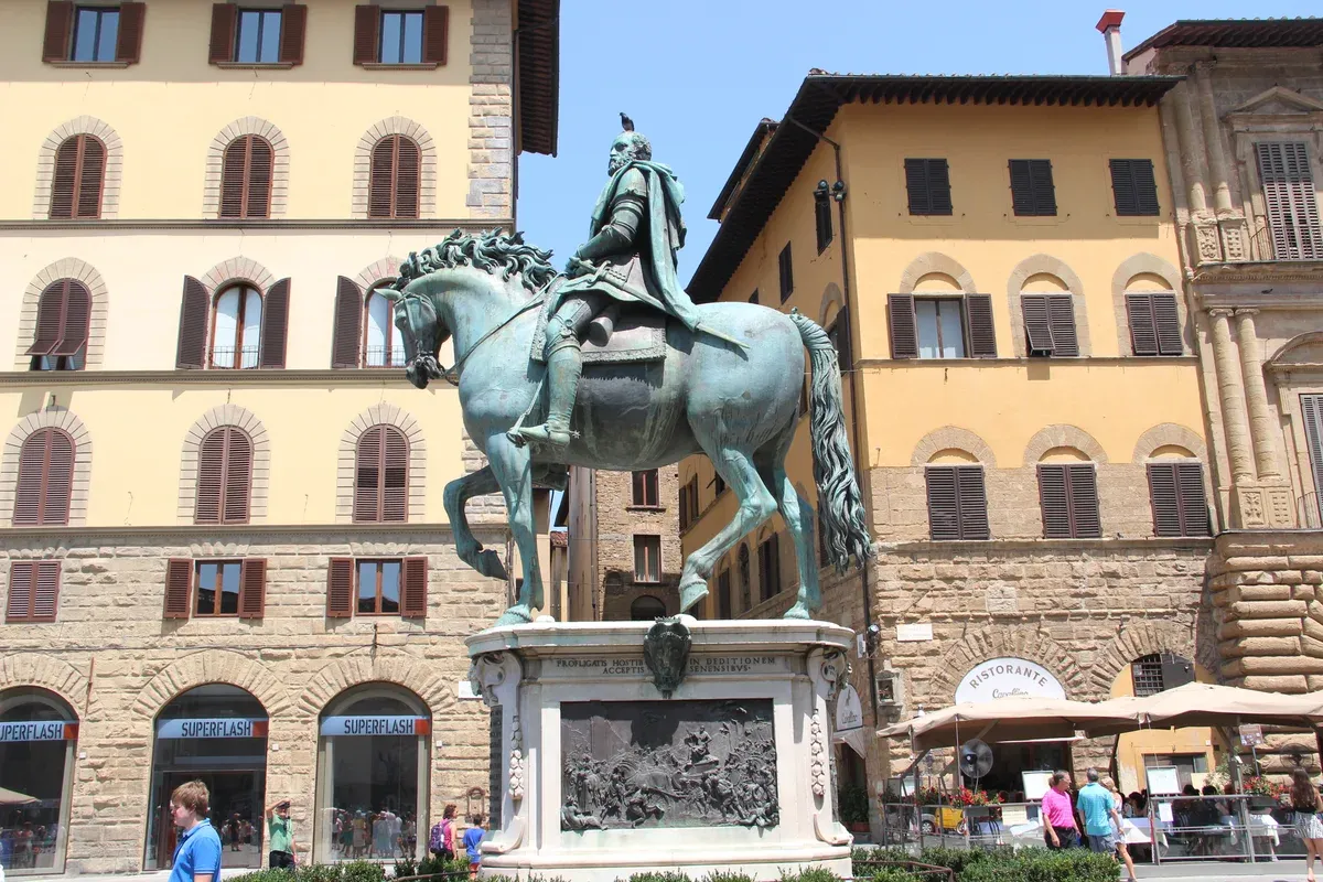 Giambologna's bronze equestrian statue of Cosimo I on its relief-carved base in Piazza della Signoria, Florence